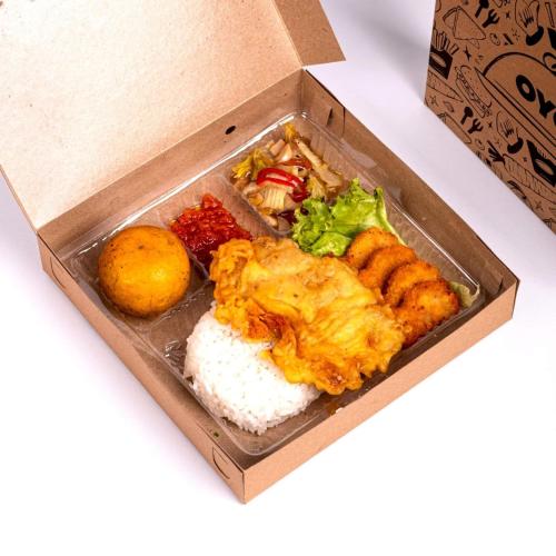 a box of food with rice and other foods at OYO 354 '32 Guest House in Batu