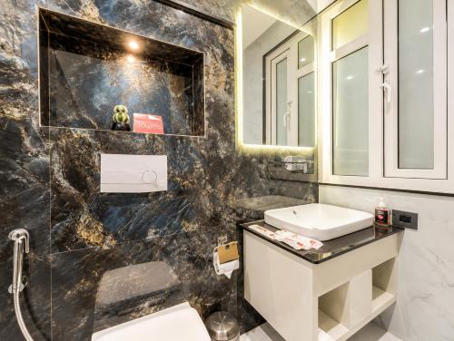 a bathroom with a sink and a mirror at Zip by Spree Hotels R Group Kota - Near Coaching Hub & Oxy Park in Kota