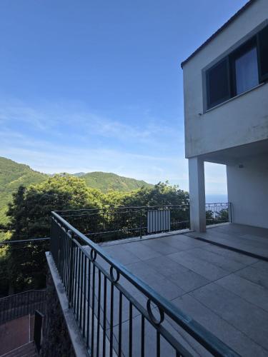 a balcony of a house with a view of the ocean at Ravello Sky & Sea in Ravello