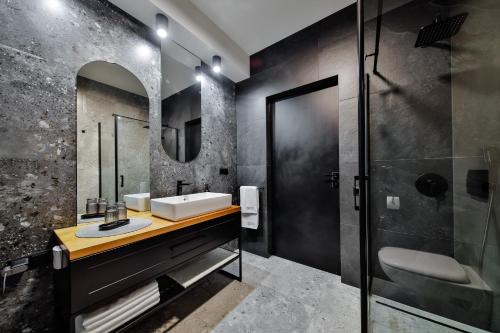 a bathroom with a sink and a mirror at Loftowe Zacisze in Bystra