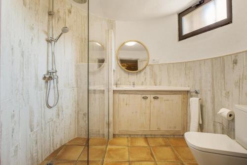 a bathroom with a shower and a toilet and a sink at Cal Potret in Argençola