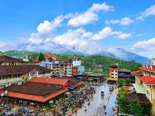 an overview of a city with a crowd of people at Aurora Hotel SaPa in Sapa
