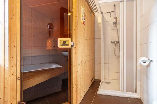 a bathroom with a sink and a shower at Haus K 104 in Röbel