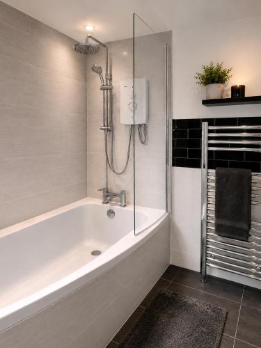 a bathroom with a bath tub and a shower at iblets in Gravesend