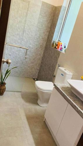 a bathroom with a toilet and a sink at Prime Lake Villa in Kundasale