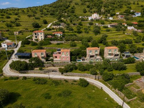 an aerial view of a village on a hill at Aegina Colors in Sfendoúrion