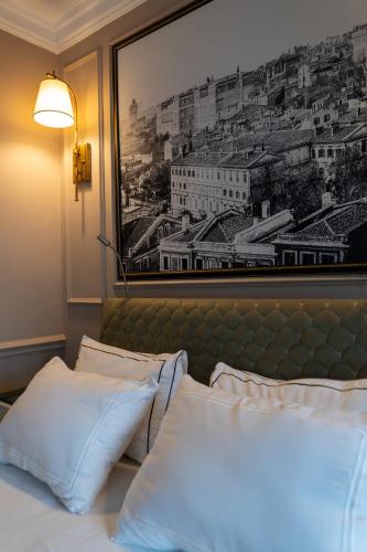 a bedroom with two beds with a picture on the wall at D-orients in Istanbul