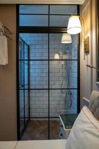 a bathroom with a shower with a glass door at D-orients in Istanbul