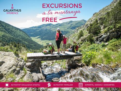 a group of people standing on a bridge in the mountains at Wuau! Hotel Galanthus & Spa in Soldeu