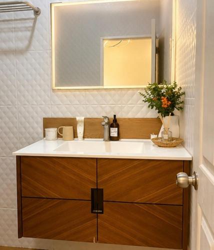 a bathroom with a sink and a mirror at blissful well treat in Ban Madua Wan