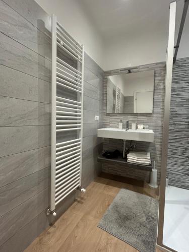a bathroom with a sink and a mirror at Rivacentro 4 in Riva del Garda