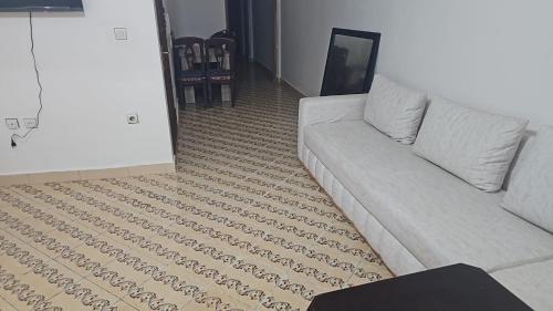 a living room with a couch and a carpet at La Casa de Madrid in Larache