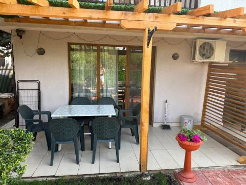 a patio with a table and chairs on it at The Lemon Villa in Rogachevo