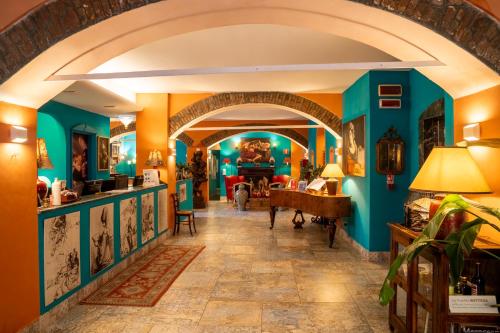 a hallway in a house with blue walls at Hotel Il Guercino in Bologna