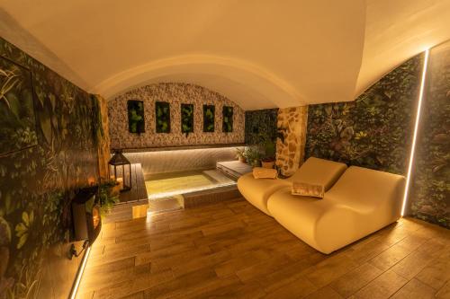 a living room with a couch and a bath tub at Hotel Il Guercino in Bologna