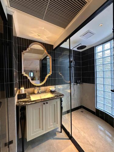 a bathroom with a sink and a mirror at Palais De Sapa Boutique Hotel in Sapa