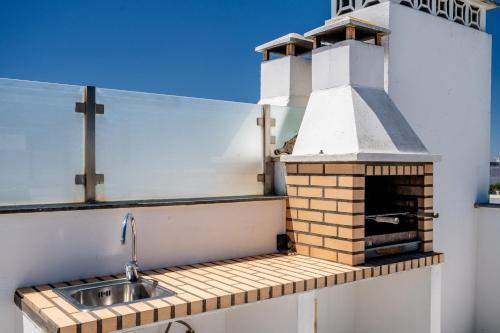 Alvor T2 com rooftop privativo e vista rio