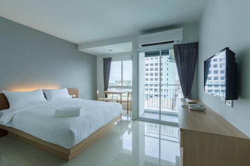 เตียงในห้องที่ Thongchen Residence