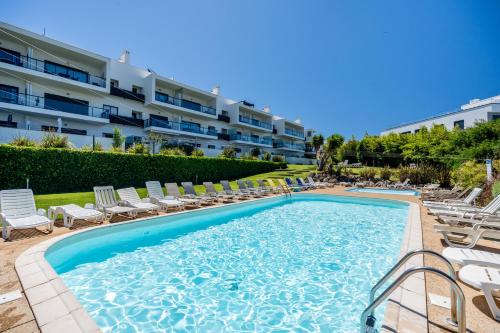 Alvor T2 com rooftop privativo e vista rio