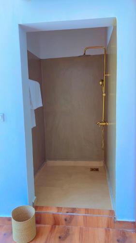 a small bathroom with a shower in a room at Verdana House in Kiwengwa