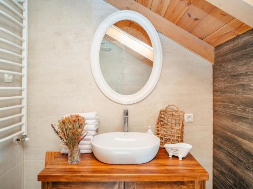 a bathroom with a sink and a mirror at Villa Elena in Cetinje