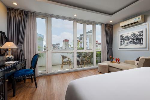 a hotel room with a bed and a large window at Golden Amour Hotel in Hanoi