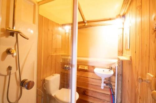 a bathroom with a toilet and a sink at Camping Pays Basque in Bidart