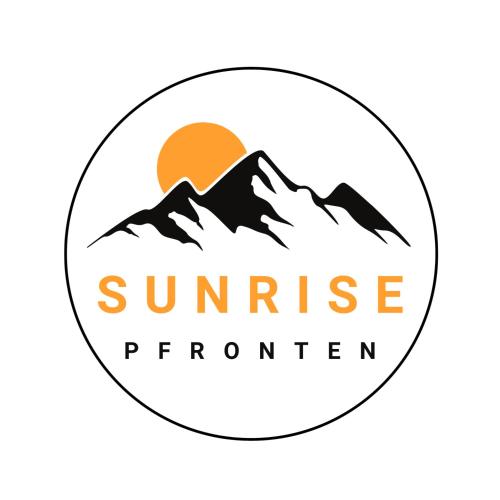 a logo of a mountain with the sun in the background at Sunrise Pfronten in Pfronten