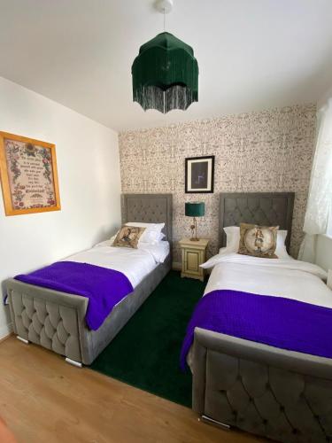 two beds sitting next to each other in a bedroom at Dunboyne Apartment in Dunboyne