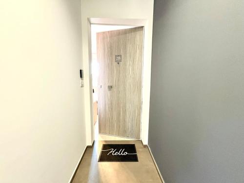 a bathroom with a mirror and a sign on the floor at Mareka Luxury Apartments in Bari