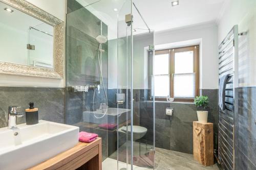 a bathroom with a sink and a shower at Appartements Lehenhof in Sankt Johann im Pongau