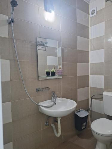 a bathroom with a sink and a toilet at Marald Eforie Nord in Eforie Nord