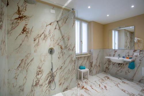 a bathroom with a shower and a sink at Europalace Hotel in Verbania
