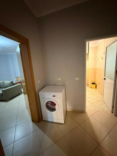 a washer and dryer sitting in a room at Alexa Beach Apartment in Velipojë