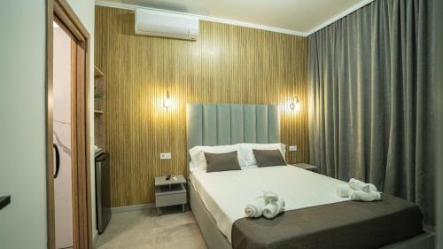 a hotel room with a bed with towels on it at Casa NOBIL in Alicante