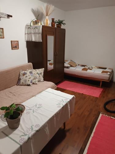 a living room with two beds and a couch at Chalupa Za zeleným plotom in Pača