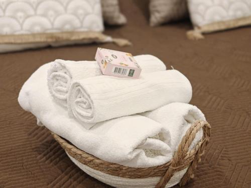 a basket of towels with a box on top at Casa Teles in Peso da Régua