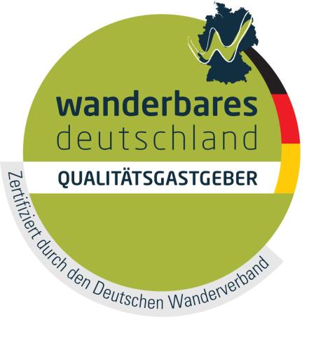 ein Logo für das Wanderers Derwentland Quartetgeistographer in der Unterkunft Refugium29a in Horn