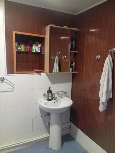 a bathroom with a sink and a shower at Дом in Shorzha