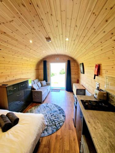 a large room with a bed and a living room at The Star Inn in Dylife