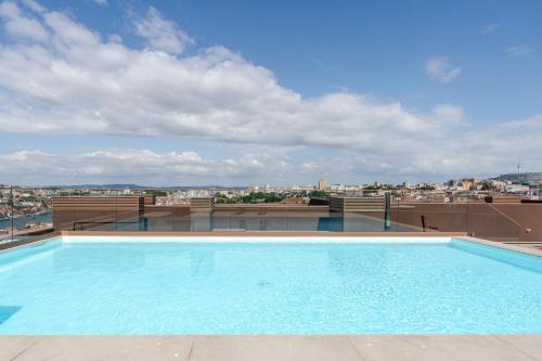 Luxury Living with Rooftop Pool and Garage by HostWise