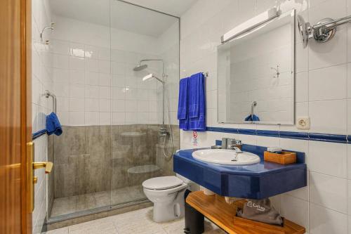a bathroom with a sink and a toilet and a shower at Callao Beach 9 in Arrieta