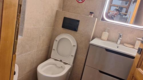a small bathroom with a toilet and a sink at Cavo Paradise Studio Cyclades in Kimolos