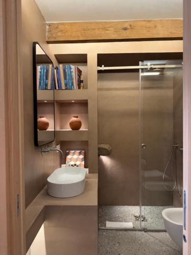a bathroom with a sink and a glass shower at Casa Lucia in Sorrento