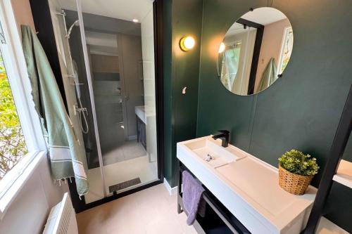 a bathroom with a sink and a mirror at Camping la Clémentine in Cendras