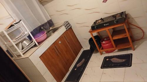 an overhead view of a kitchen with a stove and a cabinet at Urban Pulse Suites in Ruiru