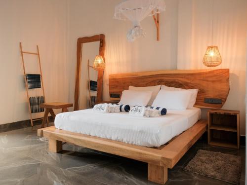 a bedroom with a bed with towels on it at Ethera Arugam bay in Arugam Bay