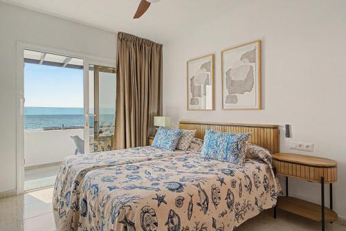 a bedroom with a bed with a view of the ocean at Callao Beach 3 in Arrieta