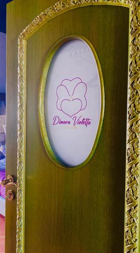 a sign on a door with a sign on it at Dimora Violetta in Alberobello