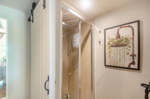 a shower in a bathroom with a picture on the wall at 2 Bed in Overton oc-k45280 in Overton
